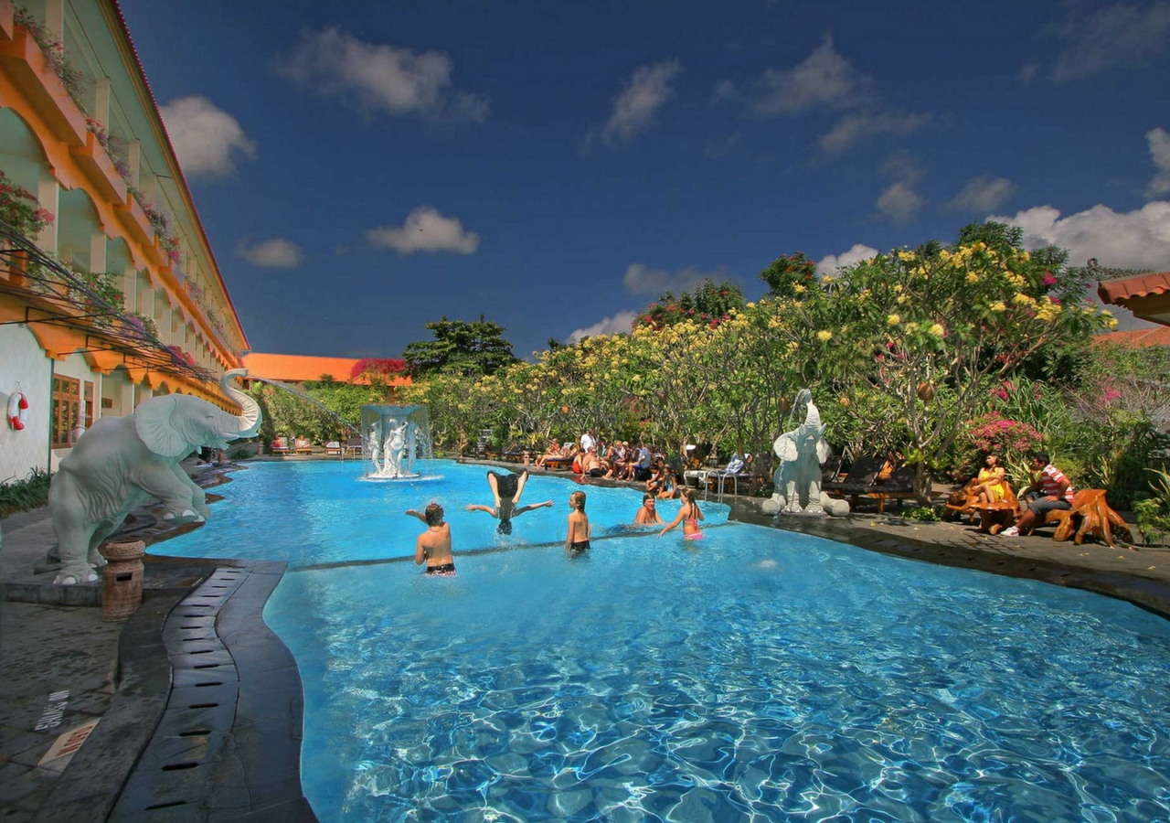 Febri's families swimming in pool at family friendly hotel in Bali, Indonesia